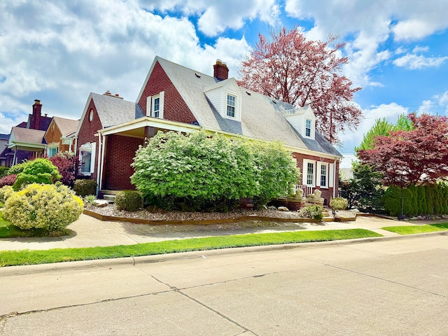 4775 Orchard Ave, Dearborn, MI 48126 - cape cod house with brick siding and a chimney