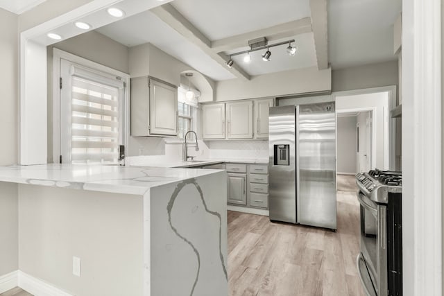 4775 Orchard Ave, Dearborn, MI 48126 - kitchen featuring stainless steel appliances, a peninsula, a sink, gray cabinets, and light stone counters