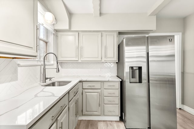 4775 Orchard Ave, Dearborn, MI 48126 - kitchen featuring stainless steel refrigerator with ice dispenser, a sink, light wood-style flooring, and tasteful backsplash