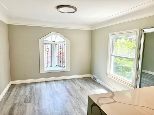 4775 Orchard Ave, Dearborn, MI 48126 - spare room featuring light wood finished floors, baseboards, and ornamental molding