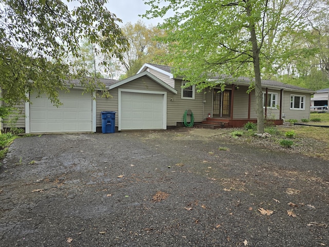 3800 W Hallett Rd, Hillsdale, MI 49242 - single story home with an attached garage, driveway, and a shingled roof