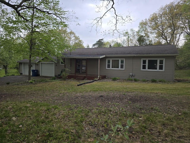 3800 W Hallett Rd, Hillsdale, MI 49242 - single story home with an attached garage, a front yard, driveway, and roof with shingles