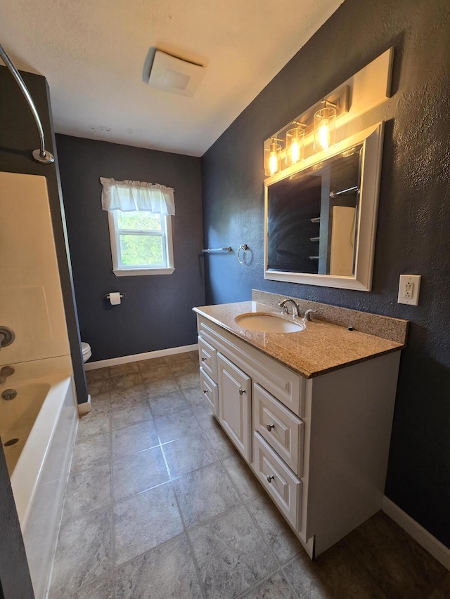 3800 W Hallett Rd, Hillsdale, MI 49242 - bathroom featuring vanity, toilet, and baseboards