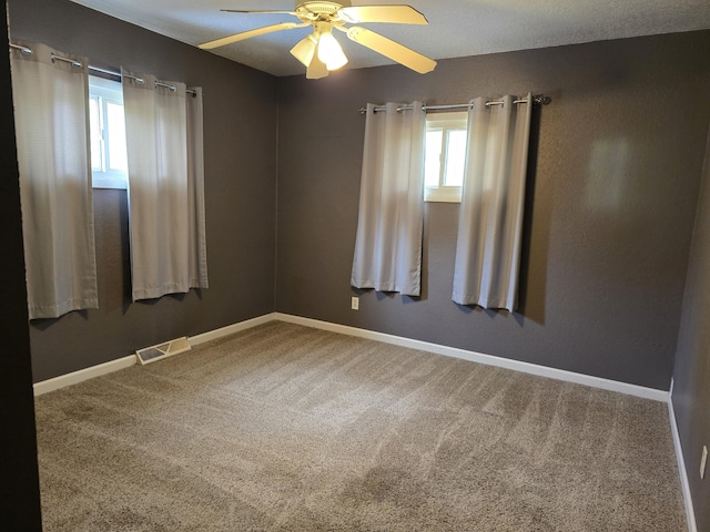 3800 W Hallett Rd, Hillsdale, MI 49242 - carpeted empty room featuring a ceiling fan and baseboards