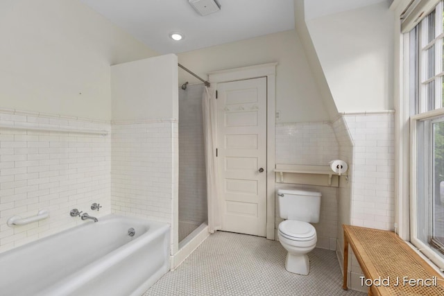 554 Madison Ave SE, Grand Rapids, MI 49503 - full bathroom with toilet, tile patterned flooring, a garden tub, tile walls, and a stall shower