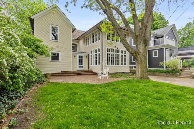 554 Madison Ave SE, Grand Rapids, MI 49503 - back of house with a yard and a patio