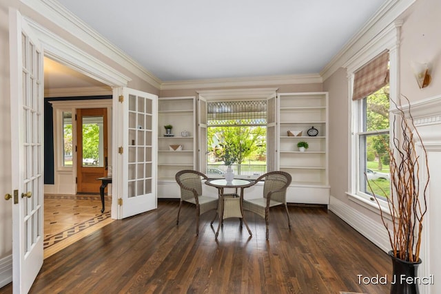 554 Madison Ave SE, Grand Rapids, MI 49503 - dining space featuring french doors, dark wood finished floors, crown molding, and baseboards