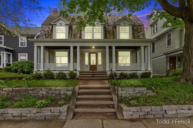554 Madison Ave SE, Grand Rapids, MI 49503 - view of front of property featuring a porch and a chimney