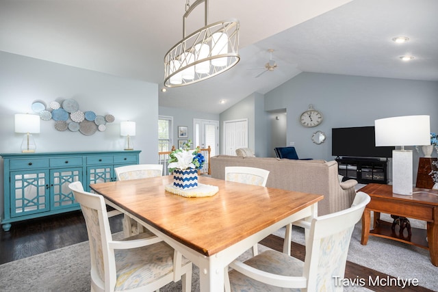 dining space featuring ceiling fan, vaulted ceiling, and wood finished floors
