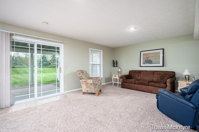 carpeted living area featuring baseboards and recessed lighting