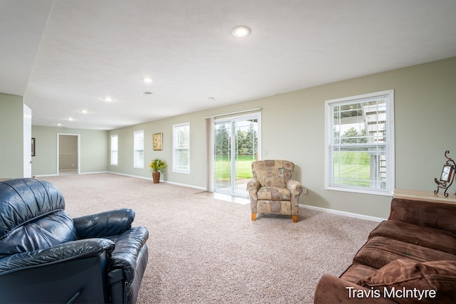 living room with baseboards, carpet floors, and recessed lighting