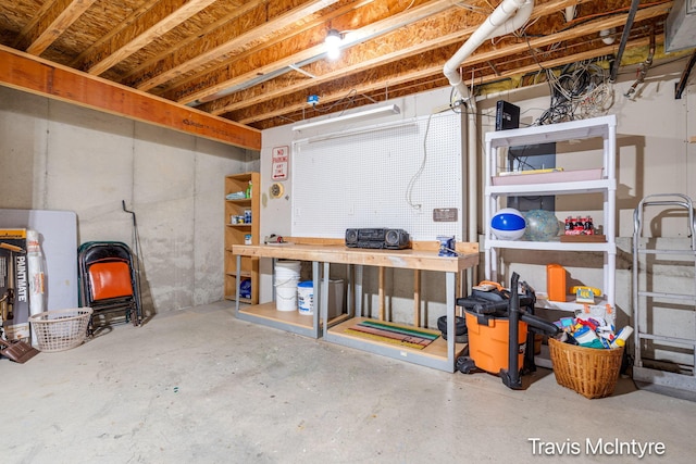 unfinished below grade area with a workshop area