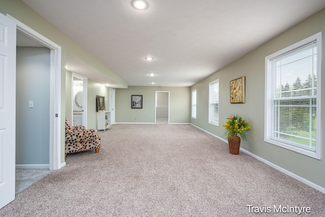 unfurnished living room featuring carpet floors, recessed lighting, and baseboards