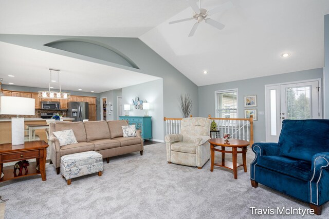 living room with light carpet, ceiling fan, vaulted ceiling, recessed lighting, and baseboards