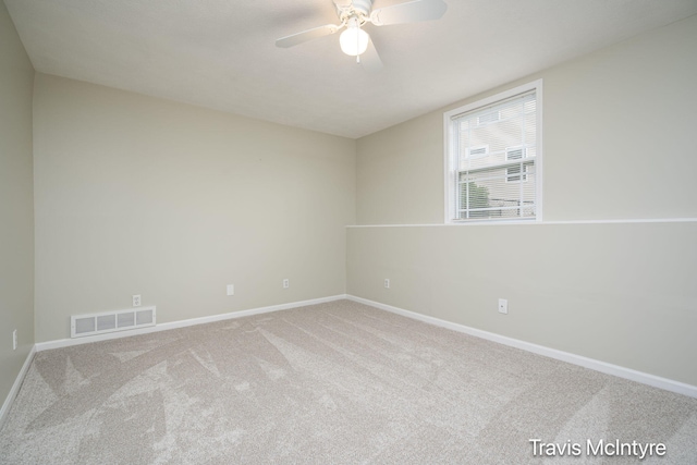 unfurnished room with carpet, baseboards, and a ceiling fan