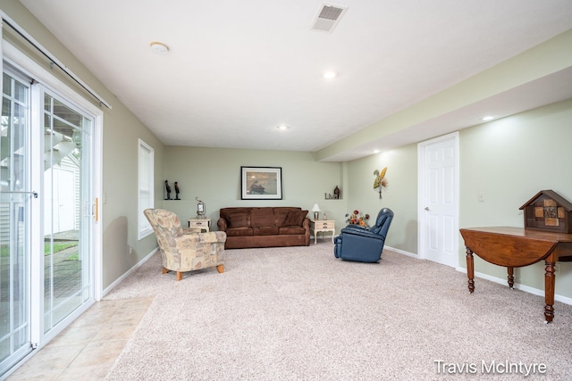living area featuring light carpet, baseboards, and recessed lighting