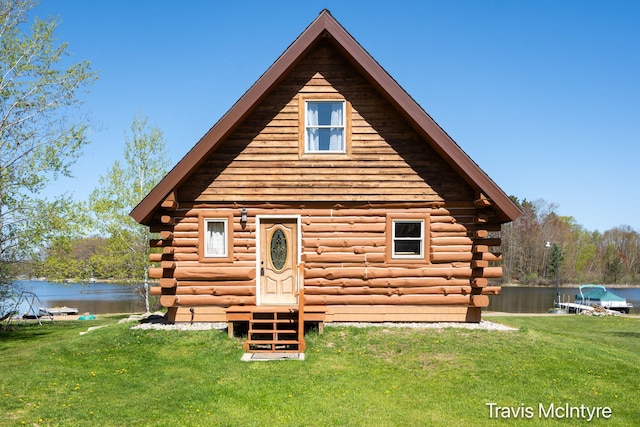 114 Horseshoe Dr, Leroy, MI 49655 - rear view of property featuring log exterior, a water view, and a yard