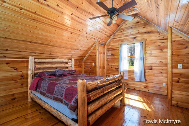 114 Horseshoe Dr, Leroy, MI 49655 - bedroom featuring wooden ceiling, hardwood / wood-style floors, vaulted ceiling, wood walls, and a ceiling fan