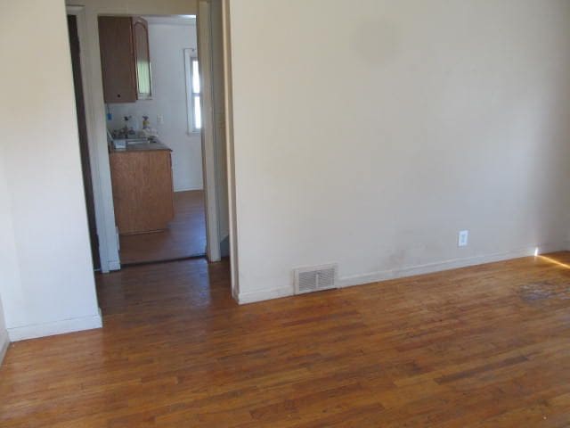 18478 Fox, Redford, MI 48240 - unfurnished room with wood finished floors and baseboards