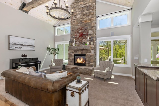 9510 Sparta Ave NW, Sparta, MI 49345 - living area featuring high vaulted ceiling, a stone fireplace, baseboards, a chandelier, and carpet floors
