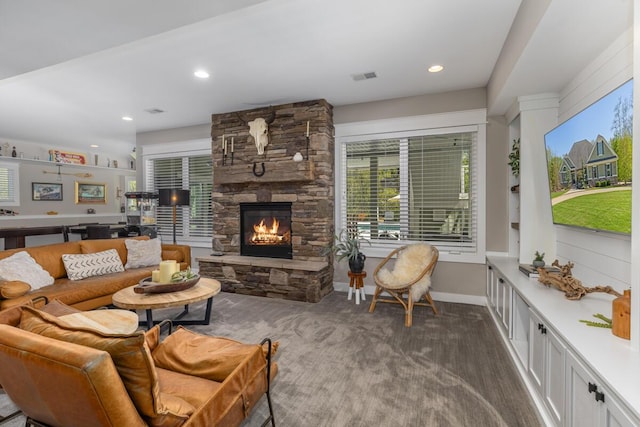 9510 Sparta Ave NW, Sparta, MI 49345 - living area with a fireplace, baseboards, recessed lighting, and dark colored carpet