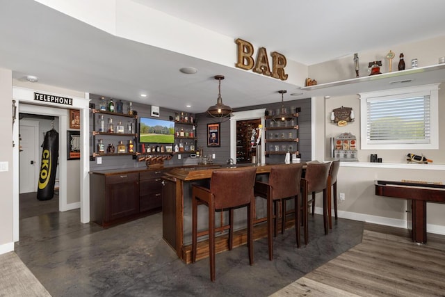 9510 Sparta Ave NW, Sparta, MI 49345 - indoor bar with baseboards and decorative light fixtures
