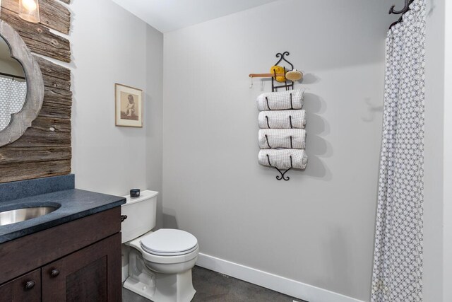 9510 Sparta Ave NW, Sparta, MI 49345 - full bath with vanity, toilet, curtained shower, and baseboards