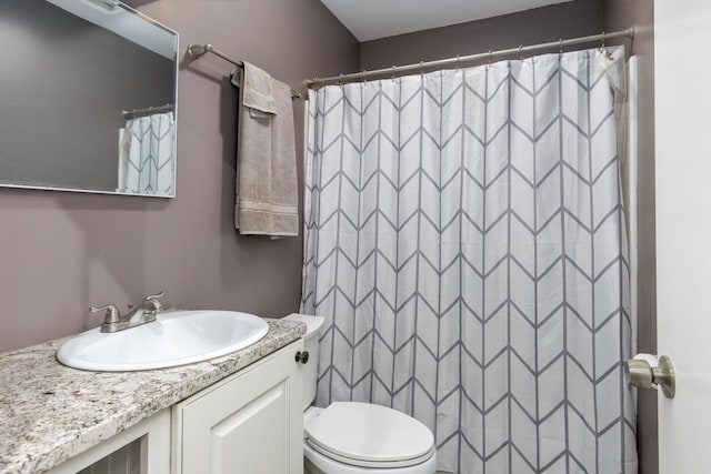 9510 Sparta Ave NW, Sparta, MI 49345 - bathroom featuring toilet, vanity, and a shower with curtain