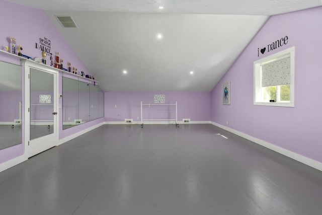 9510 Sparta Ave NW, Sparta, MI 49345 - additional living space with vaulted ceiling, baseboards, finished concrete floors, and recessed lighting