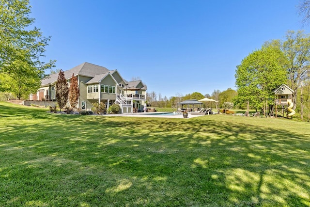 9510 Sparta Ave NW, Sparta, MI 49345 - rear view of property with a yard, a gazebo, an outdoor pool, and stairway