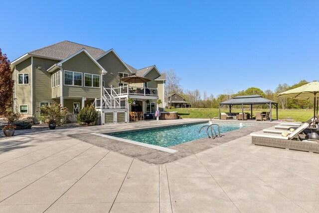9510 Sparta Ave NW, Sparta, MI 49345 - outdoor pool with a gazebo, stairs, a patio area, and a wooden deck