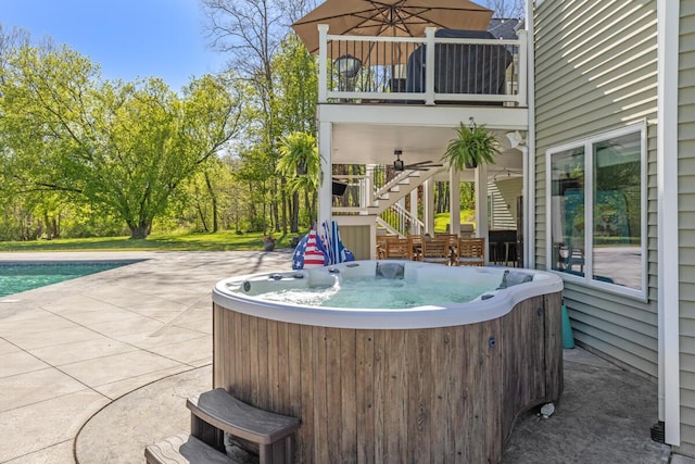 9510 Sparta Ave NW, Sparta, MI 49345 - view of patio with a hot tub, stairway, a balcony, and an outdoor pool