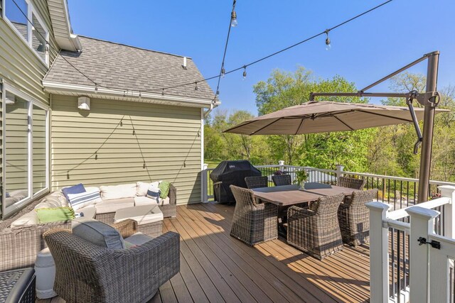 9510 Sparta Ave NW, Sparta, MI 49345 - wooden terrace with grilling area and outdoor dining space