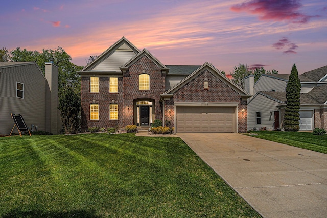 2570 Black Horse Ct NE, Grand Rapids, MI 49505 - view of front of property featuring brick siding, a garage, a yard, and driveway