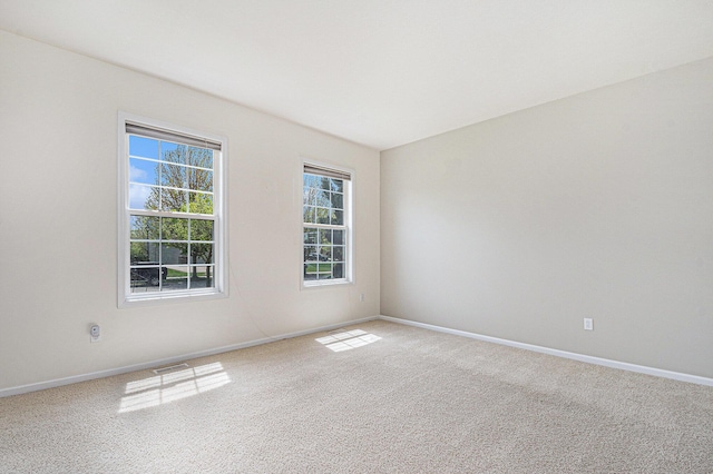 2570 Black Horse Ct NE, Grand Rapids, MI 49505 - carpeted spare room featuring baseboards