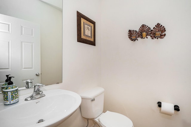 2570 Black Horse Ct NE, Grand Rapids, MI 49505 - half bathroom featuring a sink and toilet