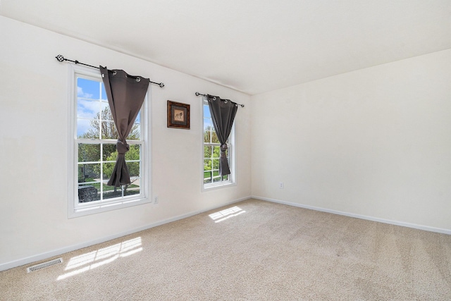 2570 Black Horse Ct NE, Grand Rapids, MI 49505 - empty room with carpet flooring, plenty of natural light, and baseboards