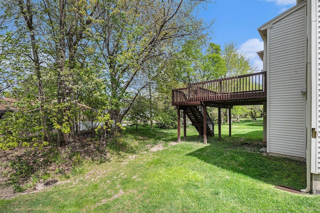 2570 Black Horse Ct NE, Grand Rapids, MI 49505 - view of grassy yard with stairs and a wooden deck