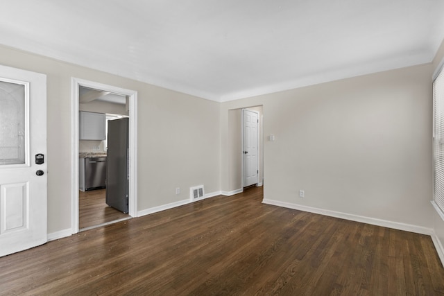 18750 Kingsville St, Harper Woods, MI 48225 - unfurnished room featuring baseboards and dark wood-style flooring