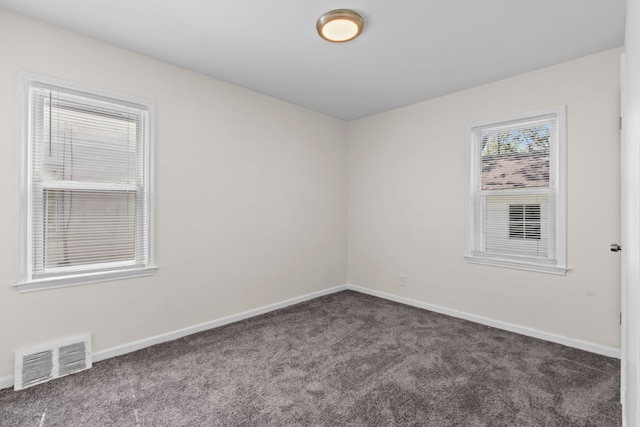 18750 Kingsville St, Harper Woods, MI 48225 - unfurnished room featuring dark colored carpet and baseboards