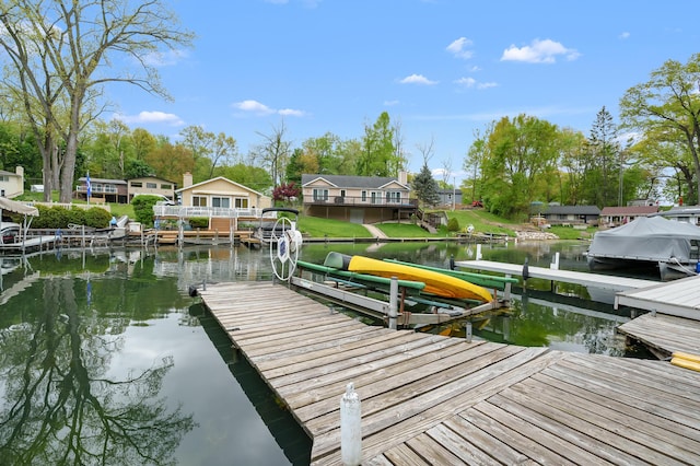 dock area with a water view and boat lift