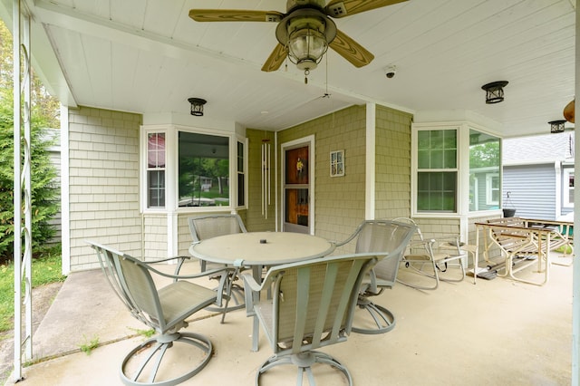 view of patio / terrace with outdoor dining space and a ceiling fan