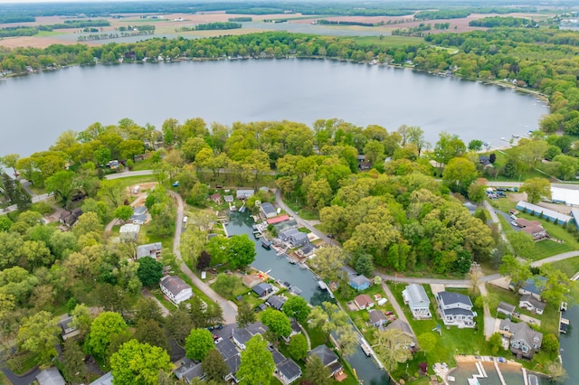 aerial perspective of suburban area featuring a nearby body of water