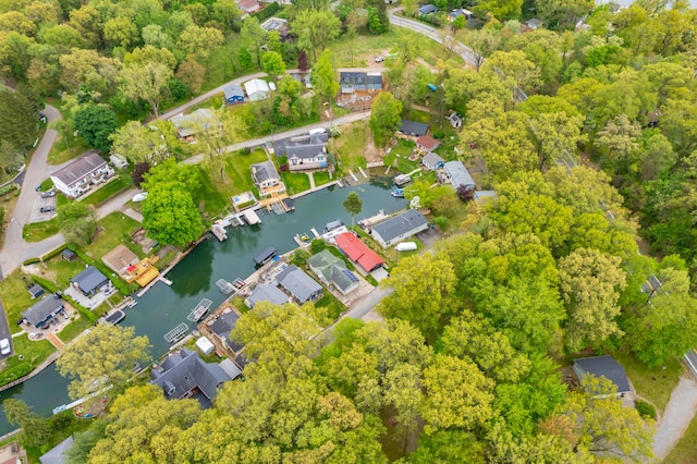 aerial overview of property's location with a large body of water and nearby suburban area