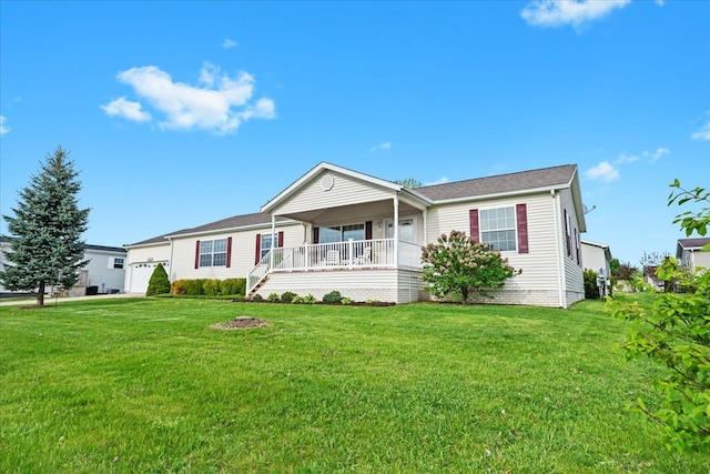 view of front of home featuring a porch, a front yard, and a garage