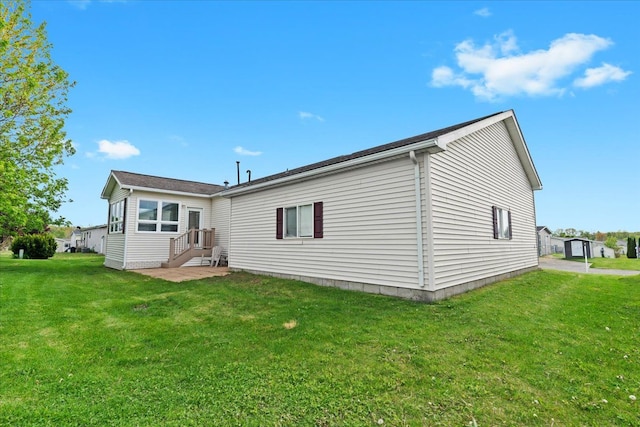 back of house featuring a yard