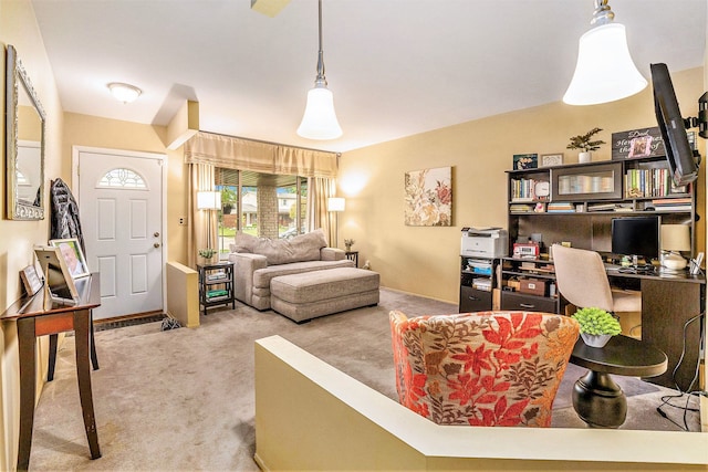 living room with carpet flooring and a desk