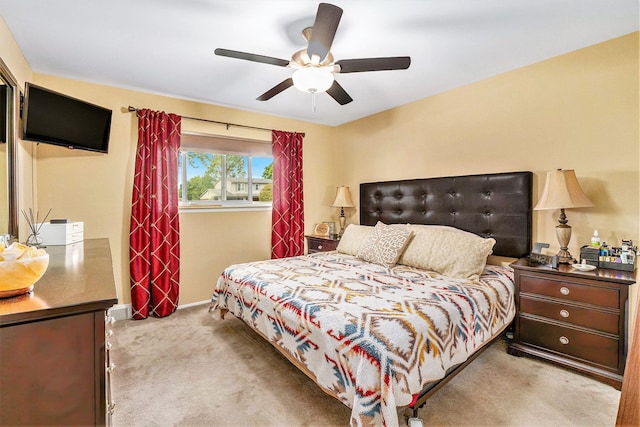 bedroom featuring carpet flooring, a ceiling fan, and baseboards