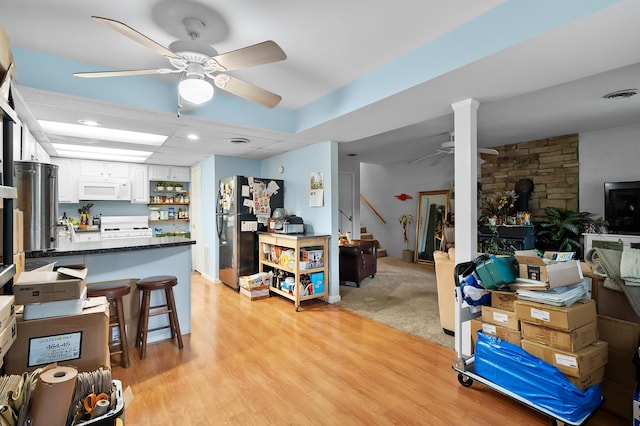 living room with ceiling fan, light wood finished floors, and recessed lighting
