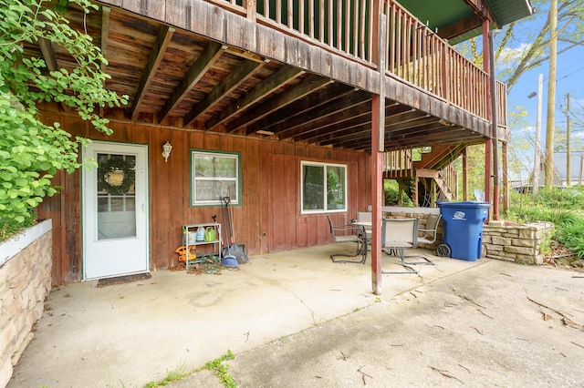 view of patio / terrace featuring stairway and outdoor dining space